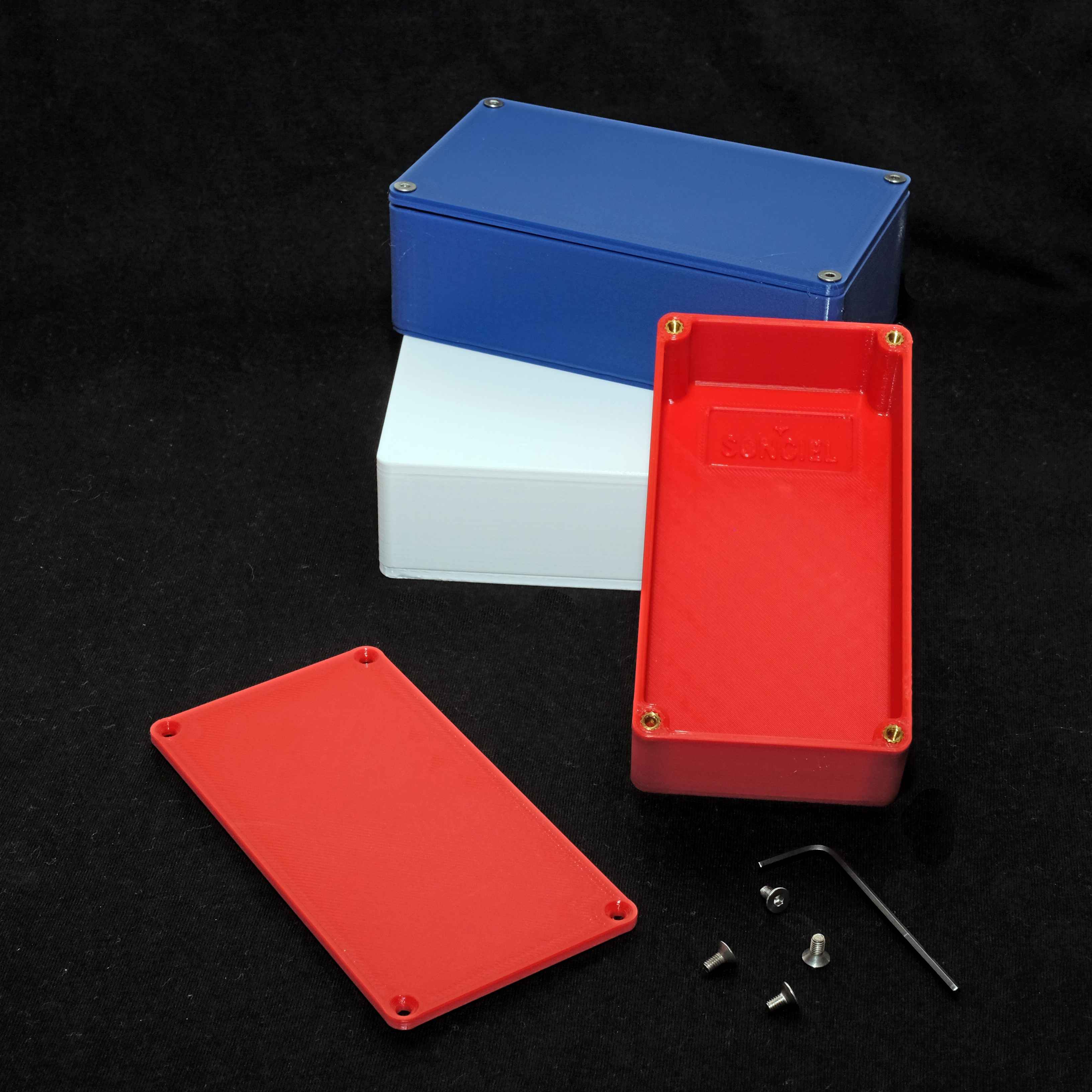 Three sizes of enclosure in red, white, and blue